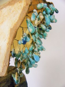 here are the individually made drops made to resemble water---I do not think I will ever use this method again---really time consuming and it resulted in a lot of glaze on my kiln shelves and glaze walls.  But I do love how it turned out visually.  